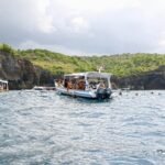 a group of people on a boat in the water